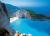 GRECE, Plage de Navagio - la plage de navagio est situe dans le nord de lle ionienne de zante (zakynthos). elle figure parmi les paysages et cartes postales les plus clbres de grce. pour vous y rendre, excursion de 1h40 en bateau depuis porto vromi ou par la route pour jeter un coup dil depuis le haut de la falaise seulement. franchement, a vaut le coup d'oeil !.